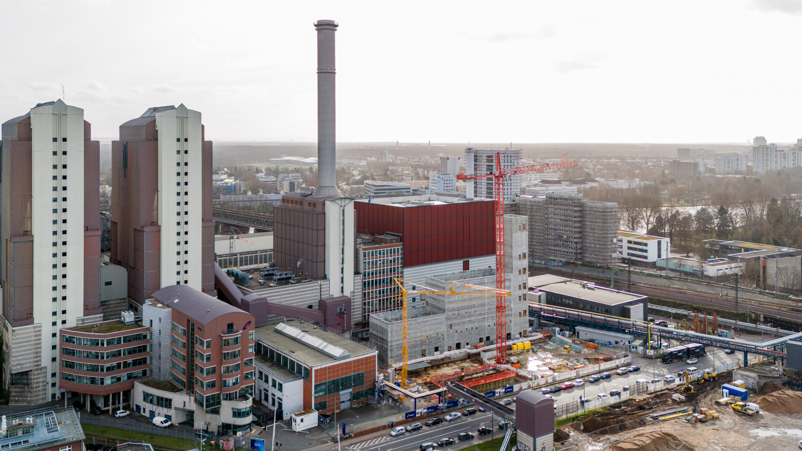 Original drone photograph of HKW West with existing plant buildings and a construction area